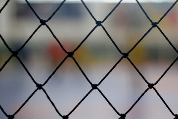 Fototapeta premium close up of a wire mesh in a basketball court, sport background