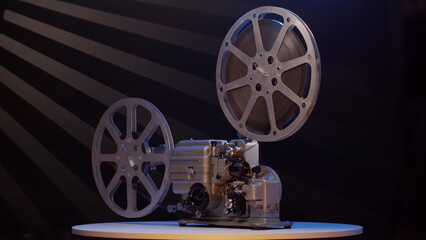 Old vintage movie projector for playing film. 16mm retro projector general view rotates. concept of an old film or cinema.