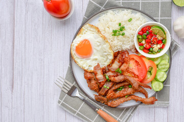 Fried pork with rice and fried egg with thai style sauce , top view,thai call kao moo thot ,copy space