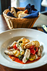 Squid stew with baby potato and baby tomatoes