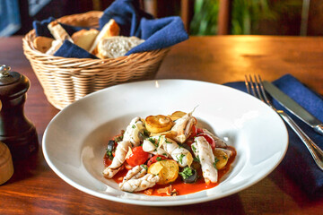 Squid stew with baby potato and baby tomatoes