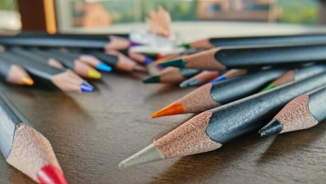 Set of Colorful Pointy Pencil Crayons and Plastic Sharpener Macro Probe Lens