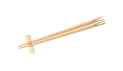 Pair of wooden chopsticks with rest isolated on white, top view