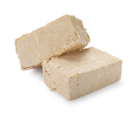 Pieces of tasty halva isolated on white
