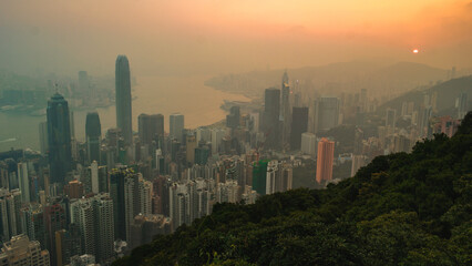 Fototapeta premium Hong Kong city view from The Peak, sunrise with foggy mist over the city of Hong Kong