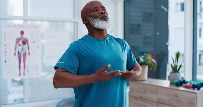 Fitness, yoga and breathing with a senior black man in a physiotherapy office for training or mental wellness. Exercise, workout and inhale with an elderly patient in a clinic for physical therapy