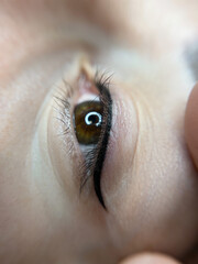 permanent eyeliner makeup close up. Healthy and clean skin young woman
