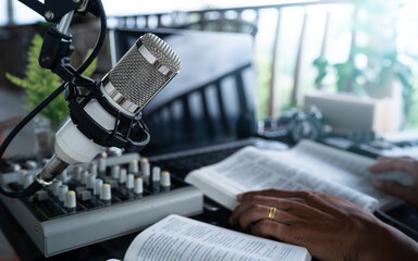 Christian podcast, preacher reading the bible online, records a podcast, online radio broadcast.