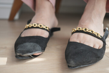 damaged women old worn torn shoes,