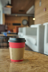 Blank take away kraft coffee cup on table ,