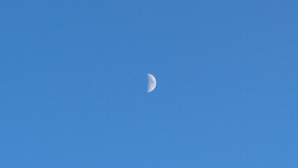 half moon in the sky daytime blue sky lunar emotional sentimental clear sky background wallpaper minimalist