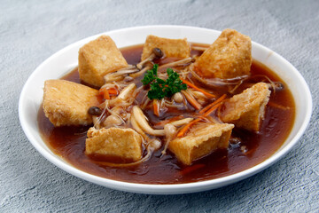 Freshly cooked Chinese food Tofu with mushroom in oyster sauce