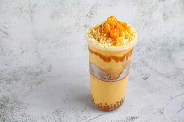 Cold beverage called Mango Graham Shake with assorted toppings