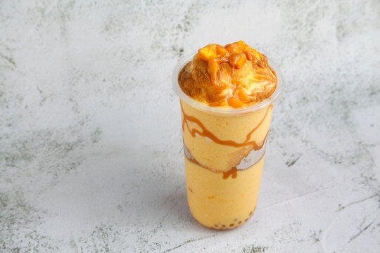 Cold beverage called Mango Graham Shake with assorted toppings