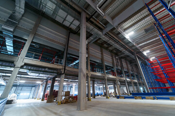 Interior of an industrial building. Huge warehouse under construction