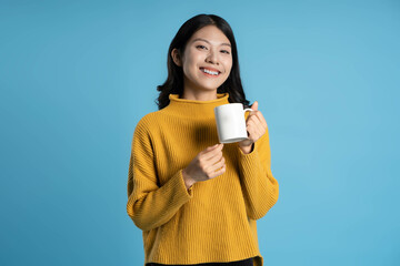 image of young asian girl posing on a blue background