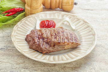 Grilled rib-eye steak beef meat