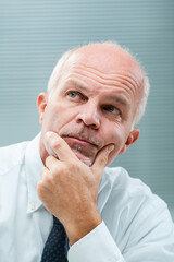 Deep in thought, executive contemplates creativity, destiny