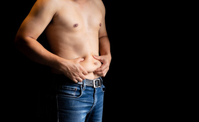 Body care concept : Shirtless man and hand pinching him excess belly fat, Fat unhealthy men...