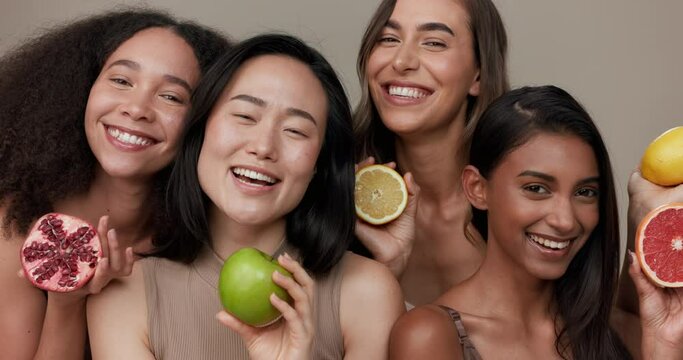 Women, portrait and beauty, diversity and fruit with dermatology and friends on studio background. Unique skin, natural cosmetics and inclusion, eco friendly skincare, smile and citrus for vitamin c