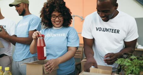Happy people, volunteer and box in teamwork, charity or community service together in NGO. Group of volunteering workers or team packing parcel, package or boxes in donations, social or contribution