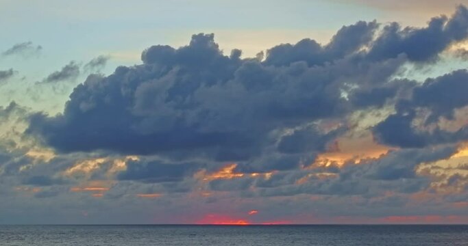 .aerial view cloud moving in nature cloudscape sky of sunset over the sea..Scene of Colorful romantic sky sunset with colorful cloud in the sky background..calm sea, waves crashing on the beach.