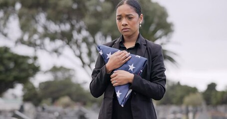 Funeral, death and american flag with a woman in a graveyard for mourning during a memorial service. Sad, usa and an army wife as a lonely widow at a cemetery feeling the pain of loss or grief