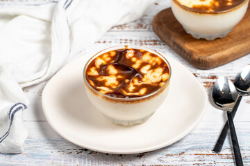 Rice pudding. Fresh delicious rice pudding on a white background. Mild dessert with milk and rice. Traditional Turkish cuisine delicacies. Local name sutlac