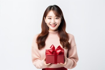 a girl with a gift in her hands and smiling. Generative AI