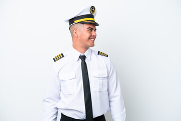 Airplane pilot caucasian man isolated on white background looking side
