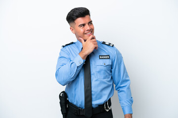 Fototapeta premium Young police caucasian man isolated on white background looking to the side