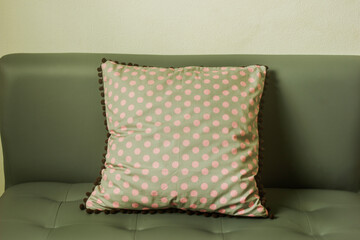 Gray cushions dot pink on the sofa.