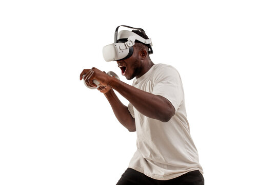 african american male boxer plays and fights in virtual reality glasses on white isolated background