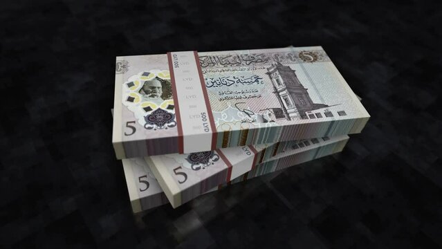 Libya money Libyan Dinar money pile pack. Concept background of economy, banking, business, crisis, recession, debt and finance. 5 LYD banknotes stacks 3d animation.
