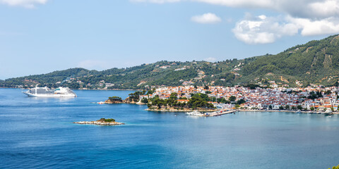 Skiathos town with cruise ship vacation at the Mediterranean Sea panorama Aegean island in Greece
