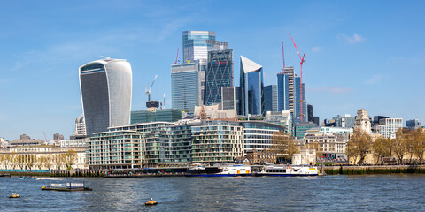 London city skyline with skyscrapers in the financial district at Thames River panorama