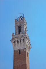 Fototapeta na wymiar Top of the town hall at the Palazzo Publicco in Siena. Tuscany, Italy,