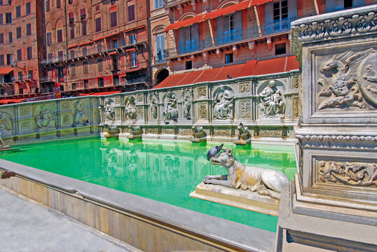 The Fonte Gaia in Piazza del Campo, his characters are a document of the early Renaissance sculpture. Siena, Tuscany, Italy, Europe