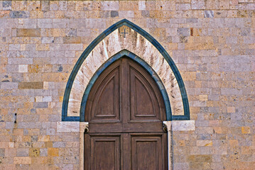 Door of Salimbeni palace on Duomo square at Sien. Tuscany Italy