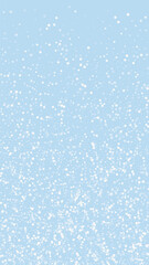 Snowfall overlay christmas background. Subtle flying snow flakes and stars on light blue winter backdrop. Festive snowfall overlay. Vertical vector illustration.