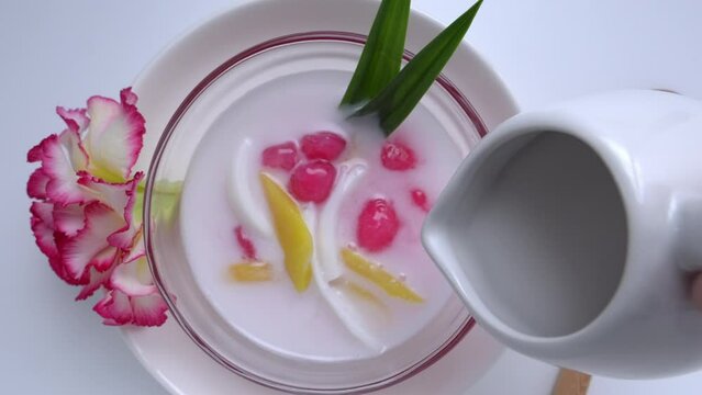 Tub Tim Krob Thai traditional dessert Crispy Ruby in coconut milk. 4k video