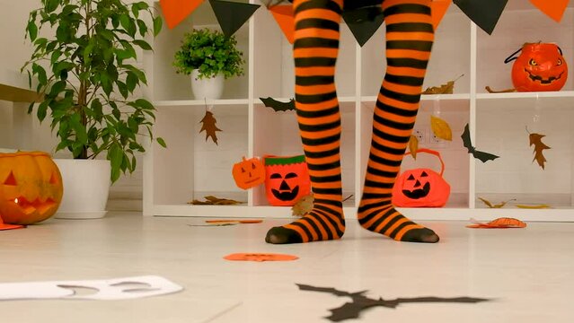 Children dance holiday Halloween legs. Selective focus.