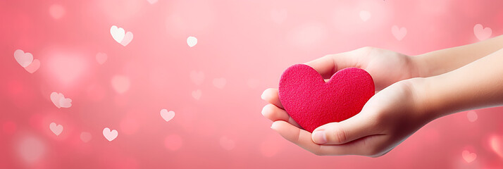 Design of two hands holding hearts on pink heart background