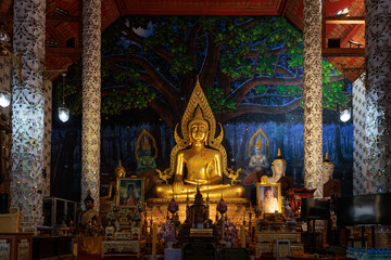 PHRAE, THAILAND - 28 September 2022 : Budda statue inside Wat Phra Tat Chorhae golden pagoda, the most famous temple in Phrae in Northern part of Thailand.