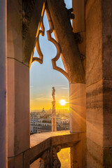 Window view from Milan Cathedral looking at the sunset