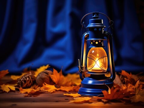 Vintage Lantern's Warm Glow Amidst Autumn Maple Leaves on Cobalt Canvas