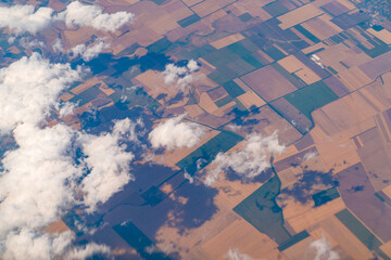 Geometrically shaped fields and the shadow of the clouds on the fields