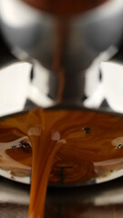 Pouring coffee espresso stream through Bottomless Portafilter