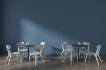 Blue cafe interior with round tables