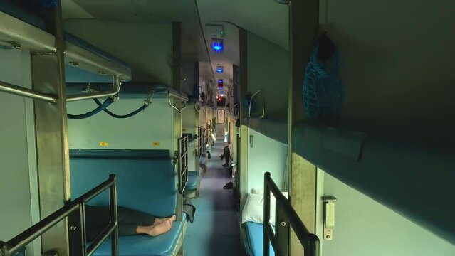 Inside interior of a sleeper class coach of the Indian railway high speed train without passengers.